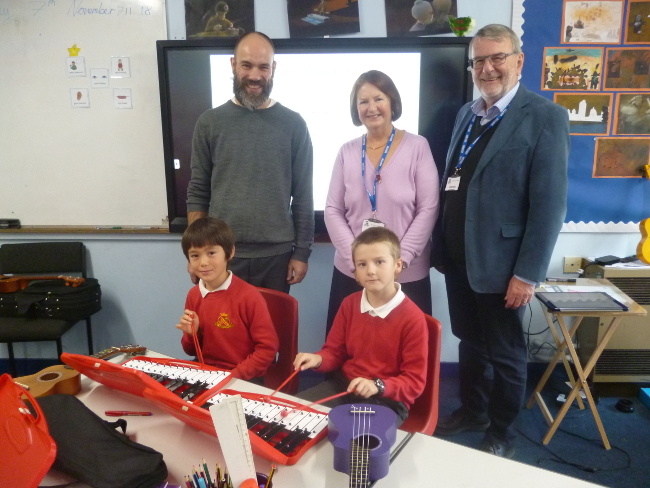 Howard Davies Chairman and Trustee and Linda Scott OBE Trustee visting the school to see the Glockenspiels in action