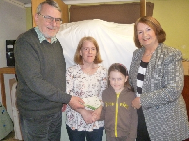 Amelia and her mother Deborah receiving Presto Classical music vouchers from Howard Davies, Chairman, and Linda Scott OBE, Trustees of the Napton Music Festival Trust.